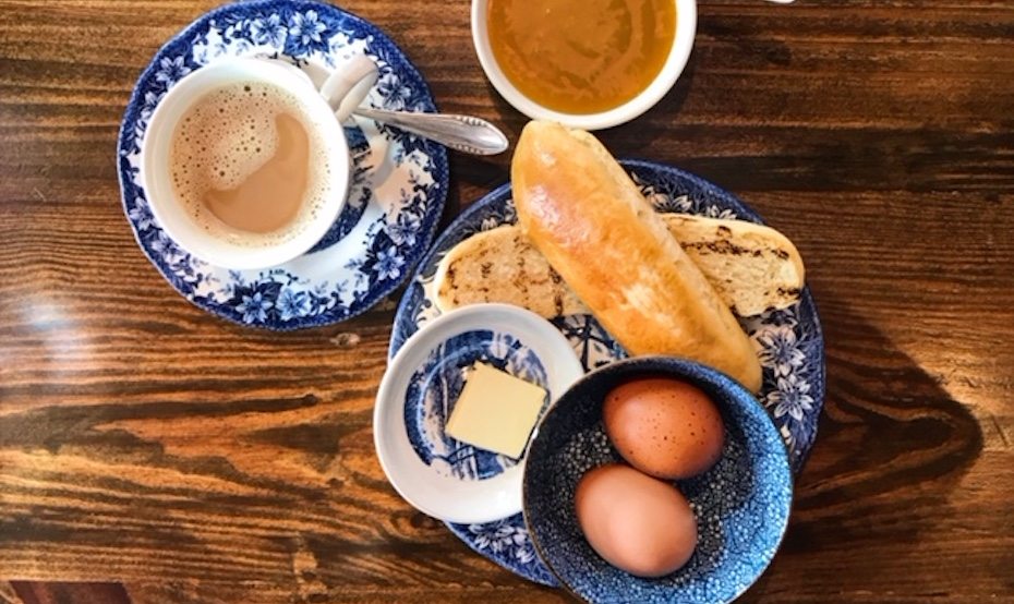 Firebake's breakfast set with local coffee, a milk bun and soft-boiled eggs. Our tip is to top up with that hand-made Hainanese kaya.