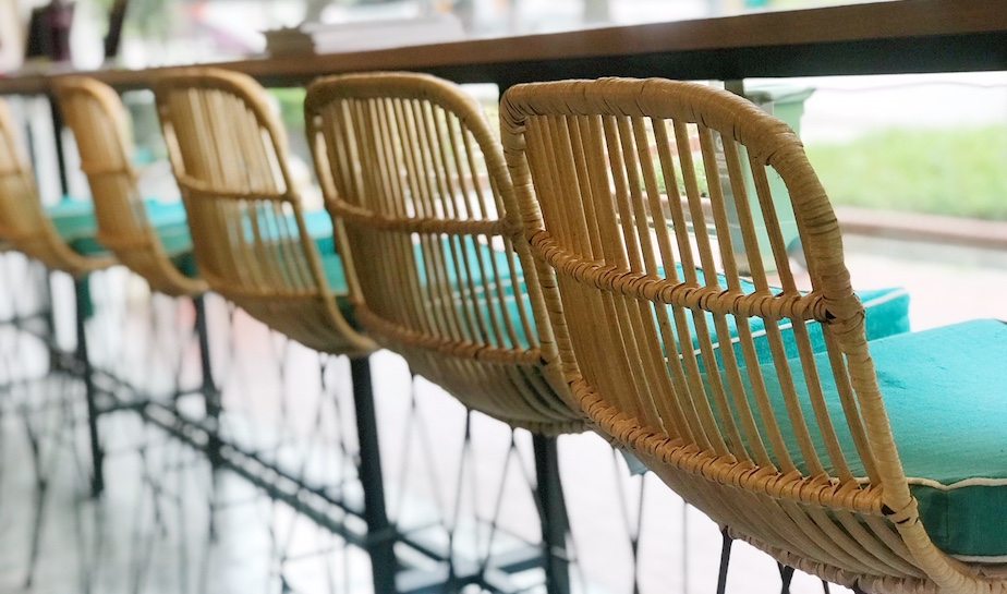 Rattan chairs and rustic wood bring Bali cafe vibes to The Social Space.