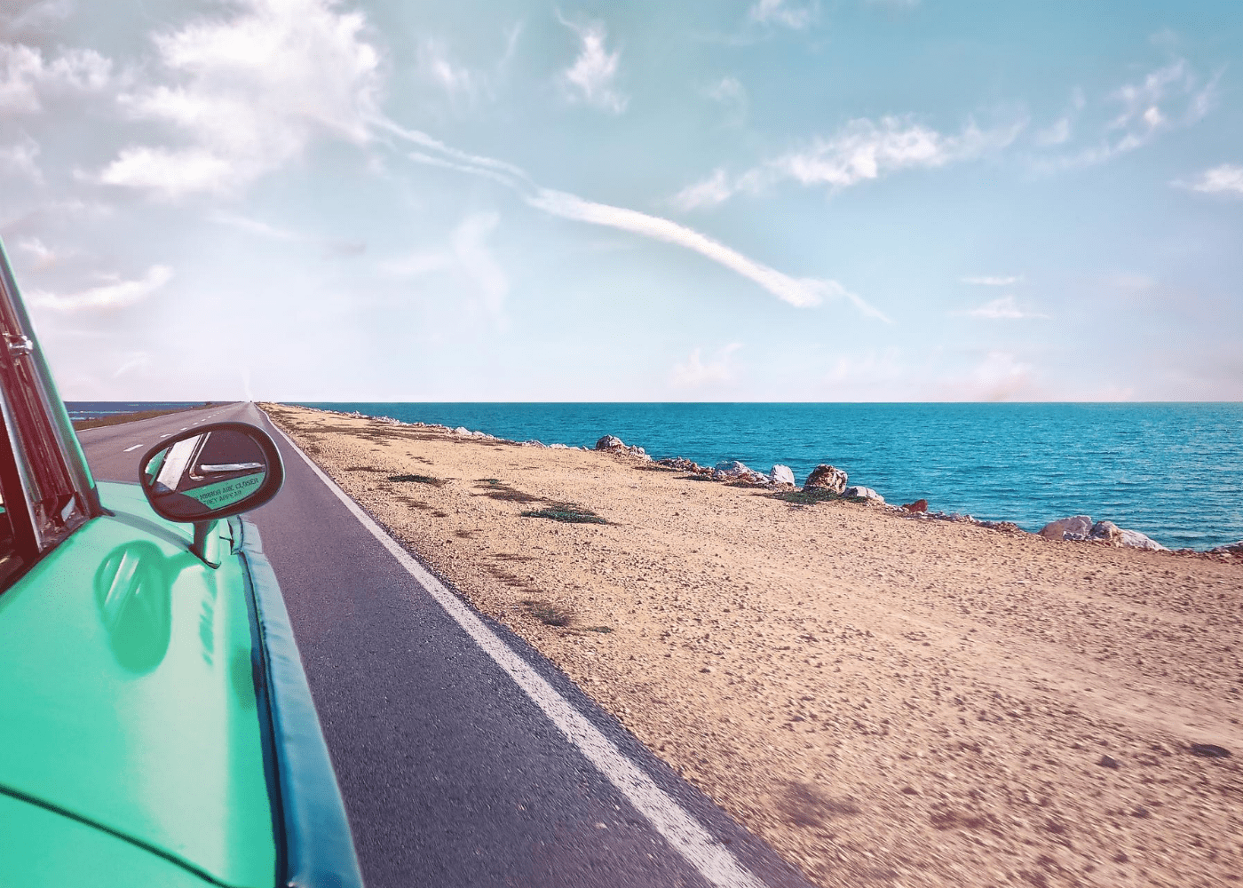 car driving down beach | public holidays 2021