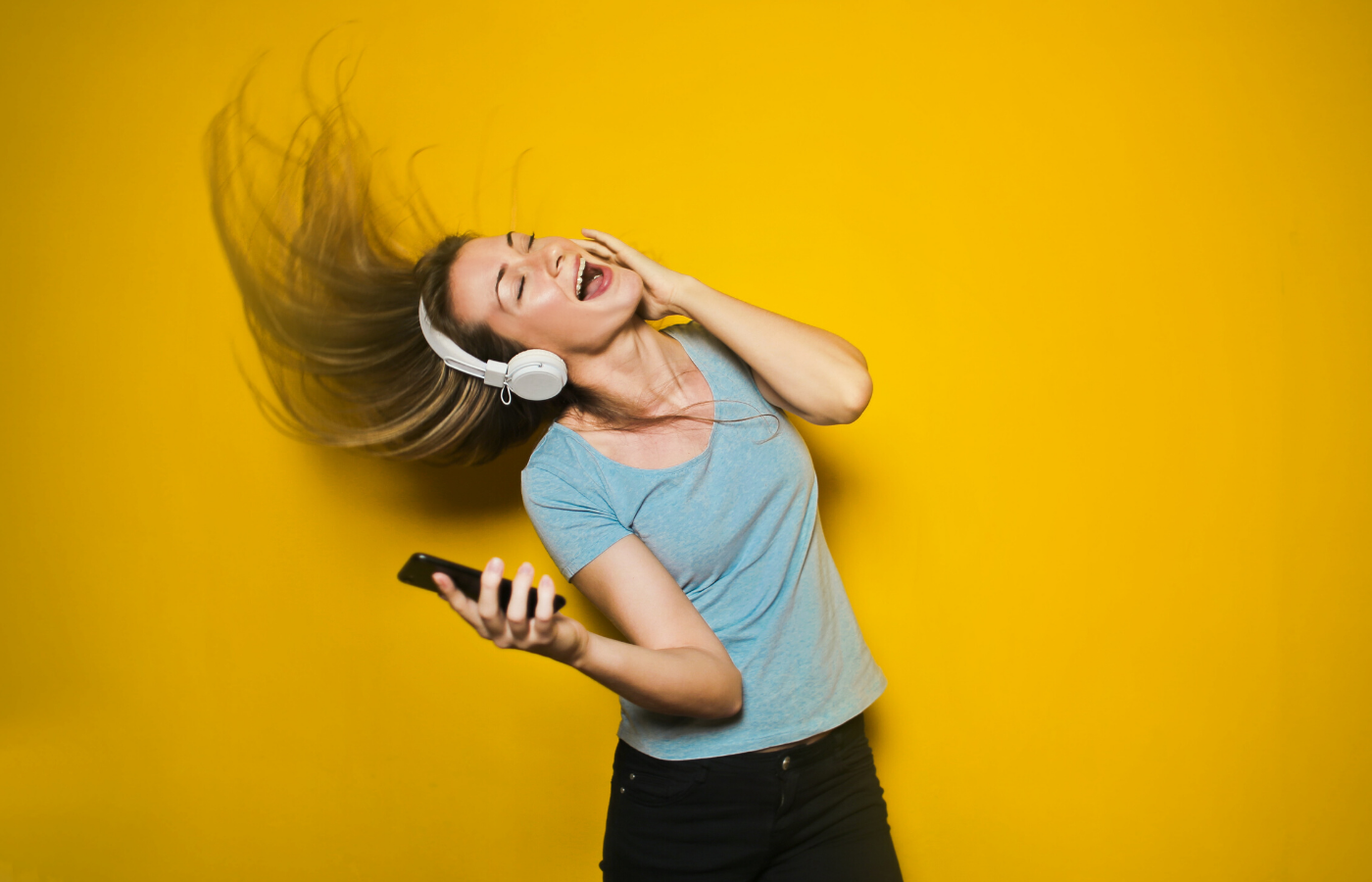 woman singing with headphones | things to do online