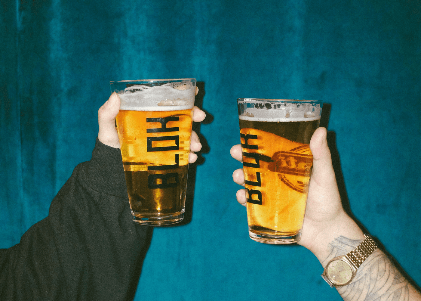 People holding cups of beer