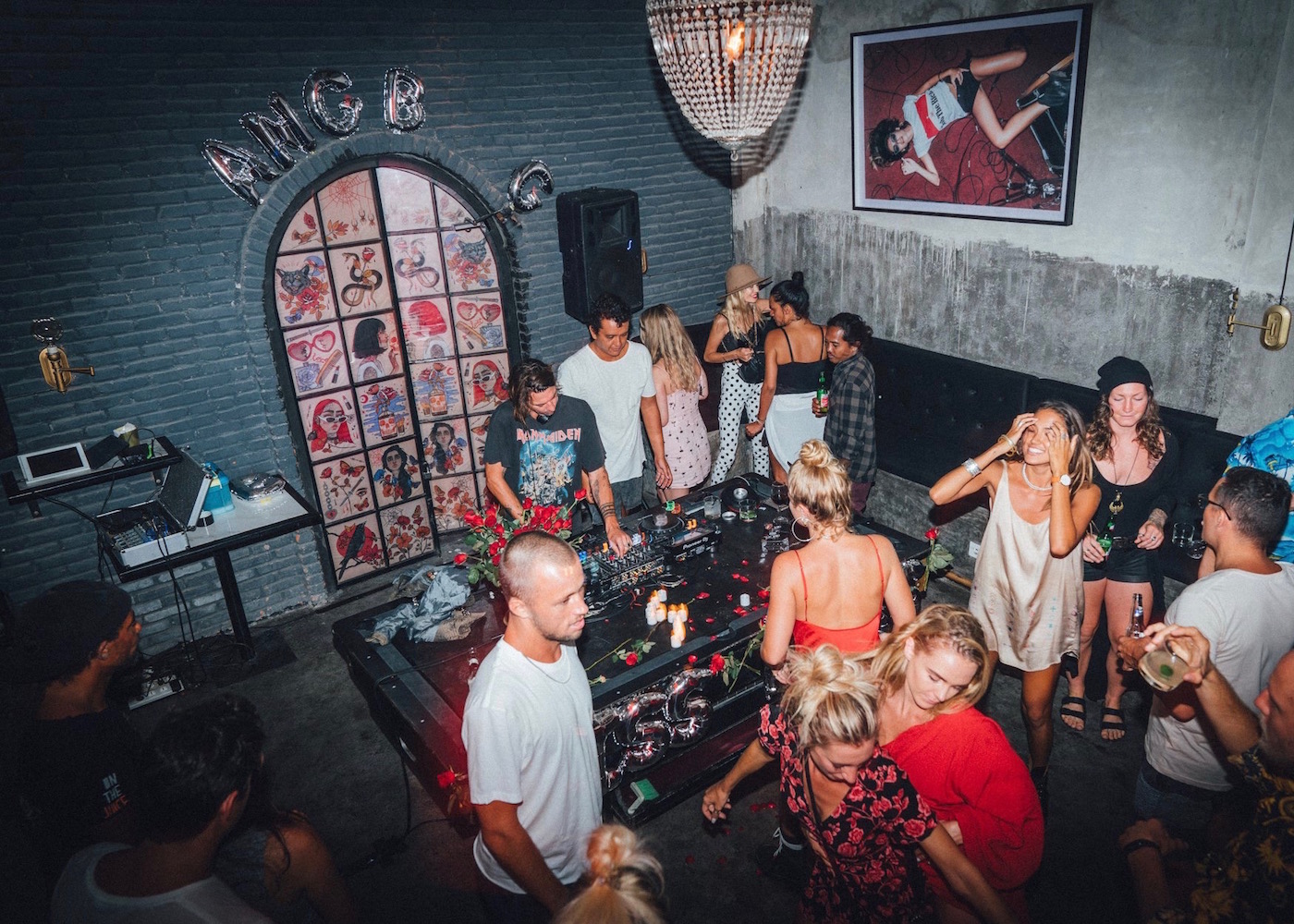 Party-goers at Black Cat Mini Mart - a hidden dive bar in Canggu, Bali, Indonesia