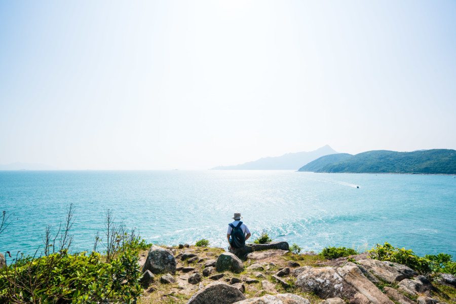 camping in Tap Mun man looking over water
