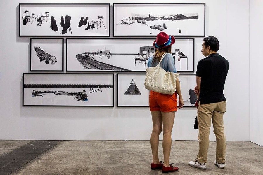 March events Art Basel people looking at art