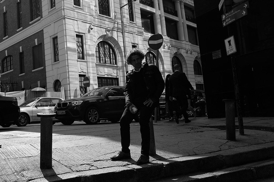 black and white photography Hong Kong man eating apple Central