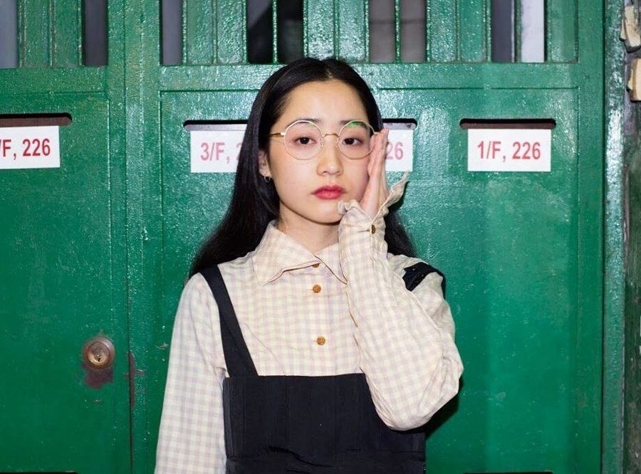 single-use plastic in Hong Kong girl wearing glasses