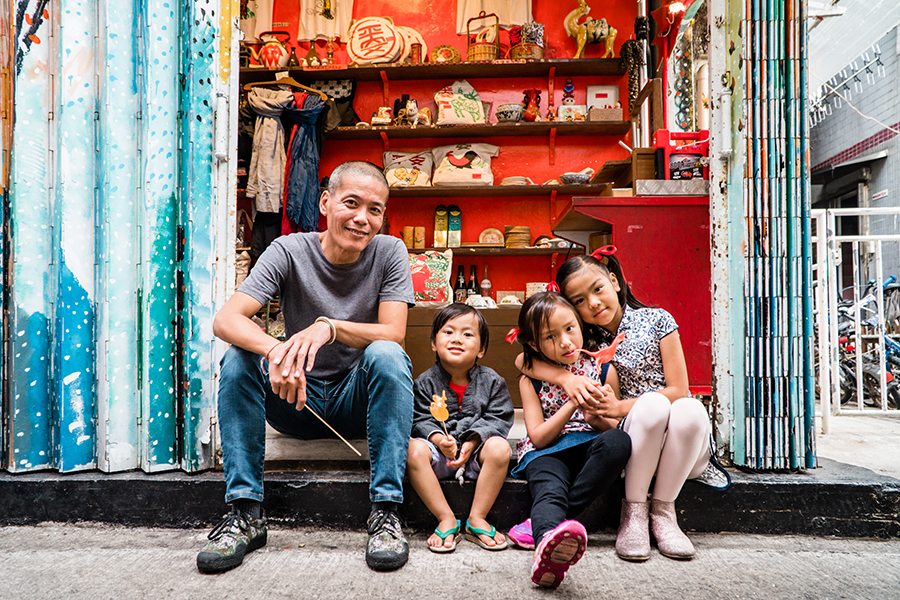 sugarman louis to and family in front of his cheung chau store
