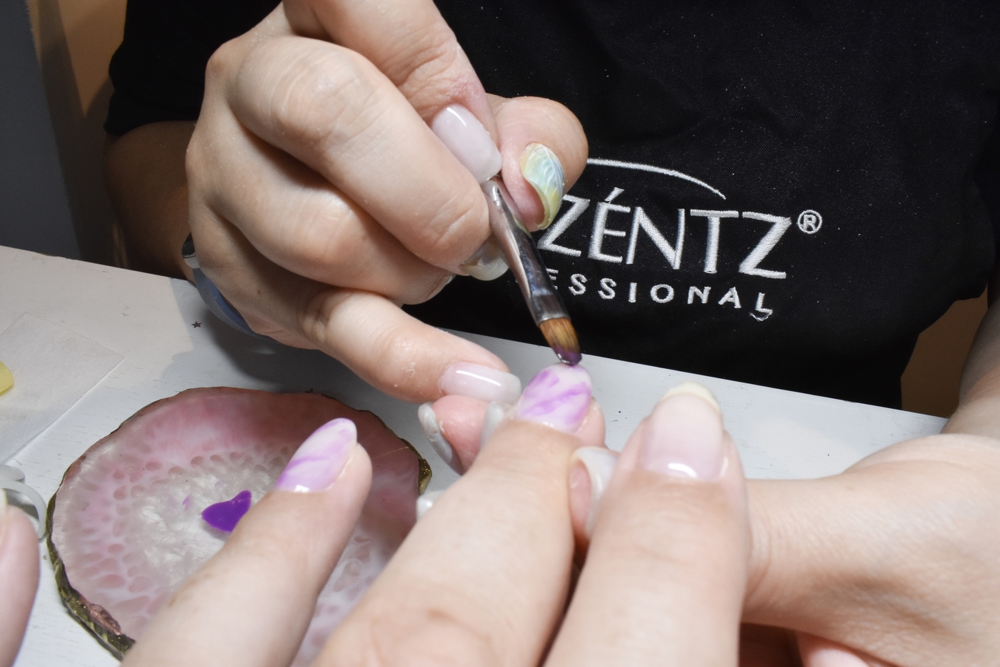 The Nailtural technician painting