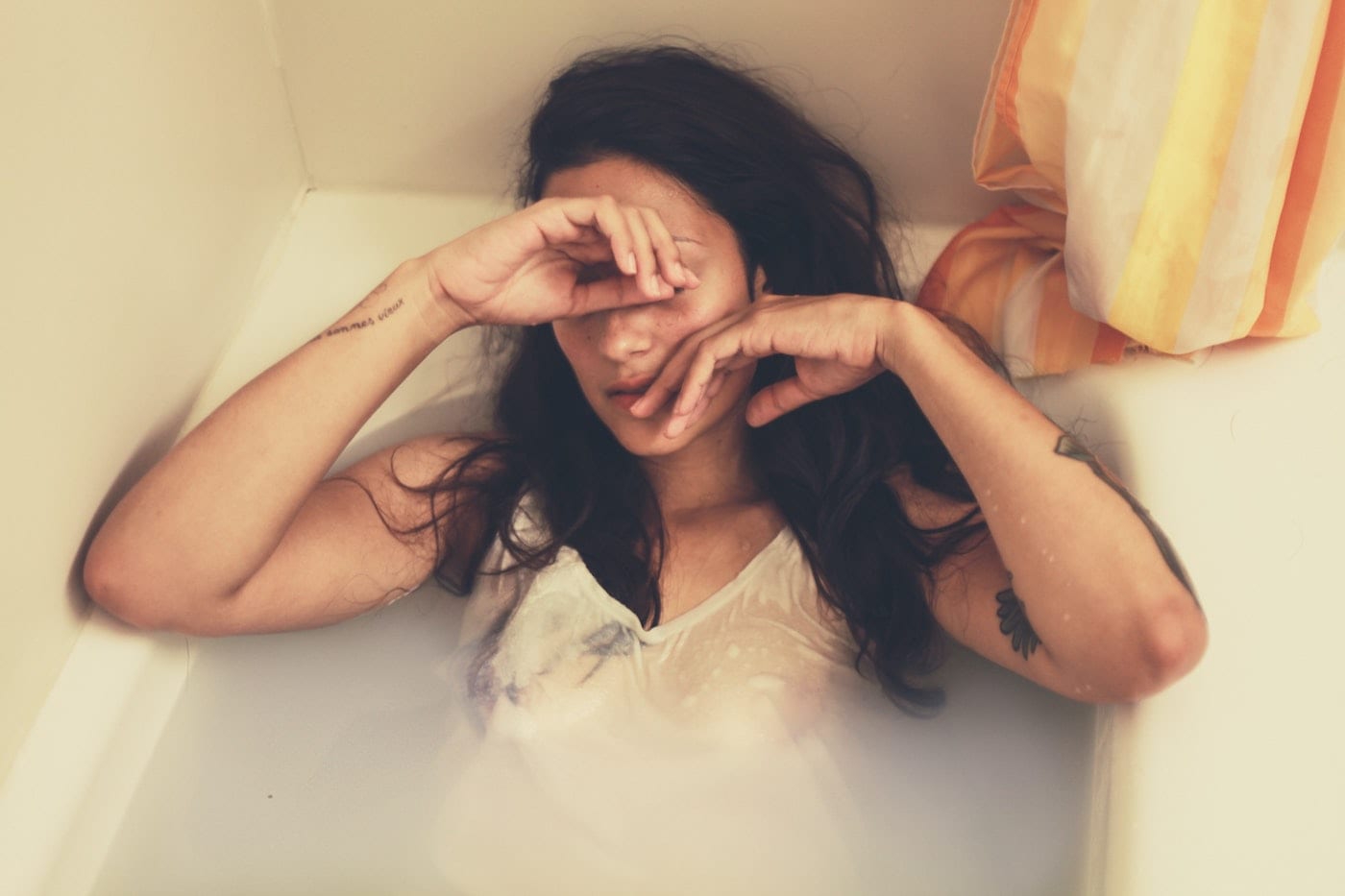 a person crying in the bathtub