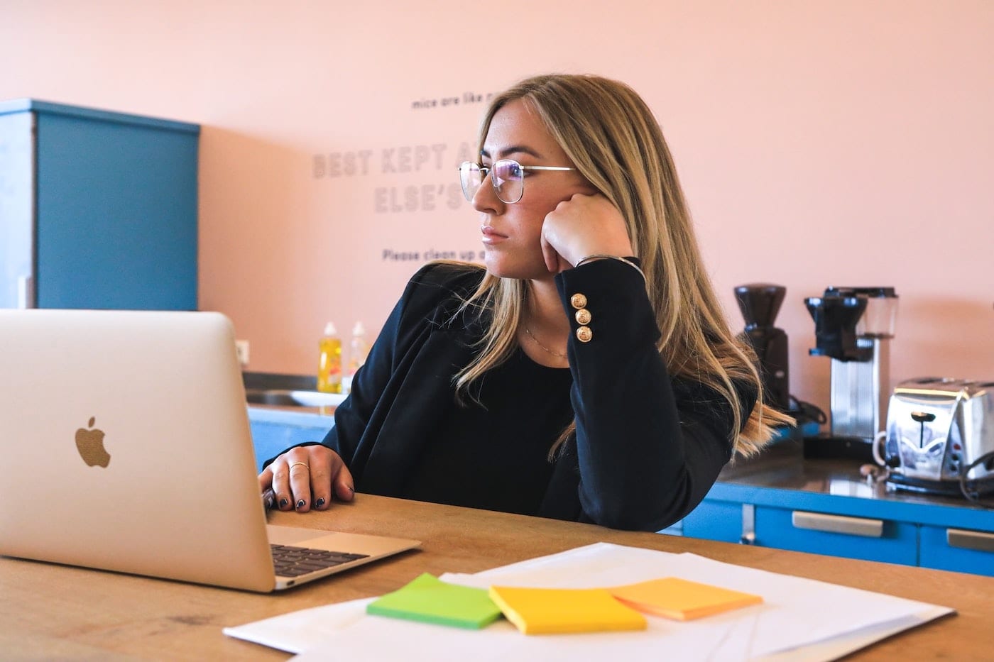 person staring at her laptop